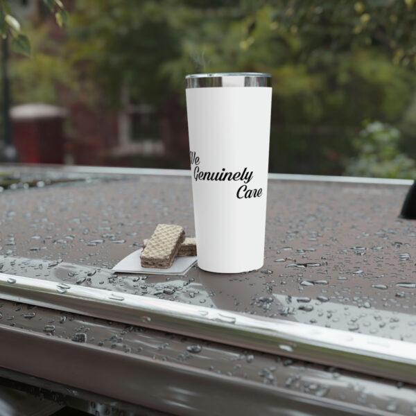 A white cup sitting on top of a table.