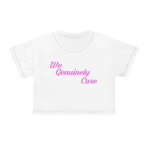 A white crop top with the words we genuinely care written on it.