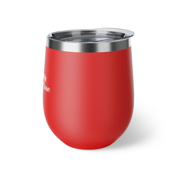 A red cup with a lid on top of it.