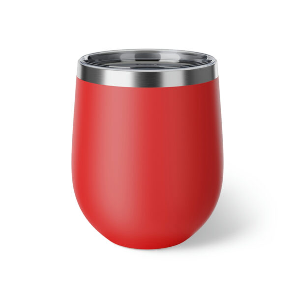 A red cup with a metal lid on top of it.