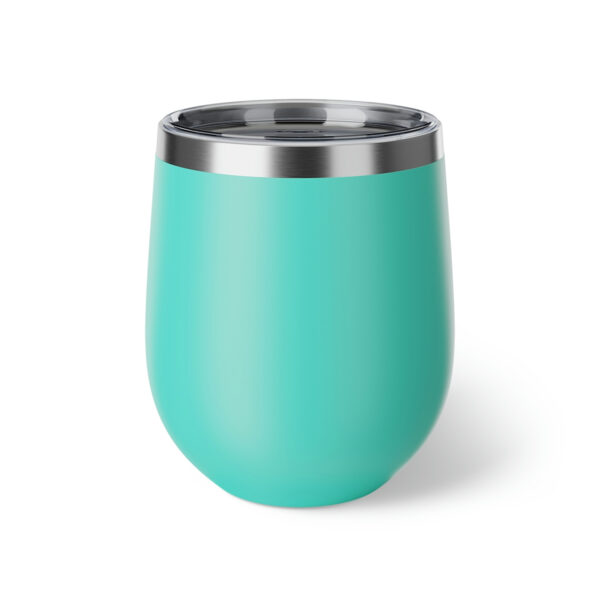 A turquoise cup with a metal lid on top of it.