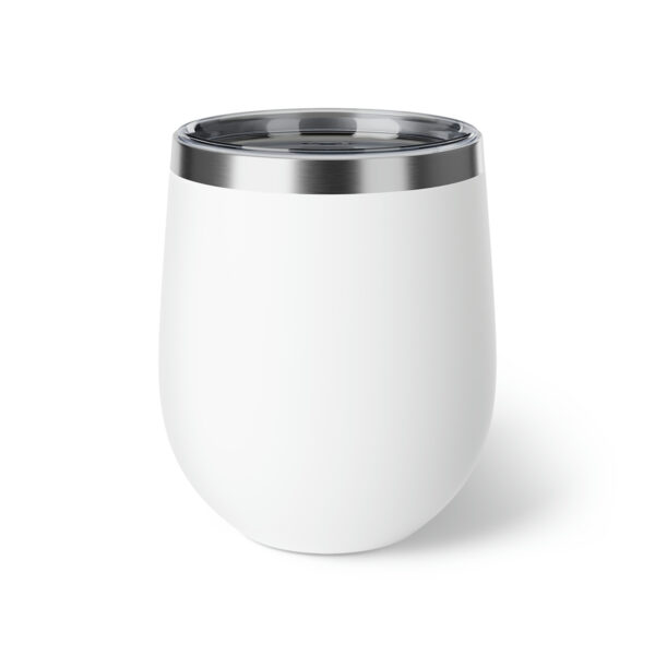 A white cup with a metal lid on top of it.