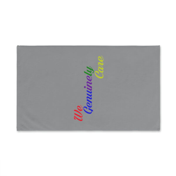 A towel with the words " humanity care " written in rainbow colors.