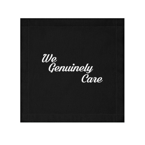 A black cloth napkin with the words " we genuinely care ".