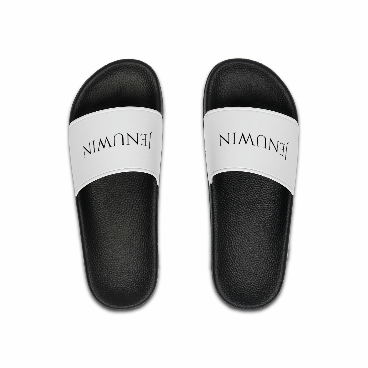 A pair of black and white sandals with the word " namaste " written on them.
