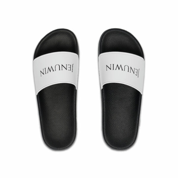 A pair of black and white slides with the word " nirvana " written on them.