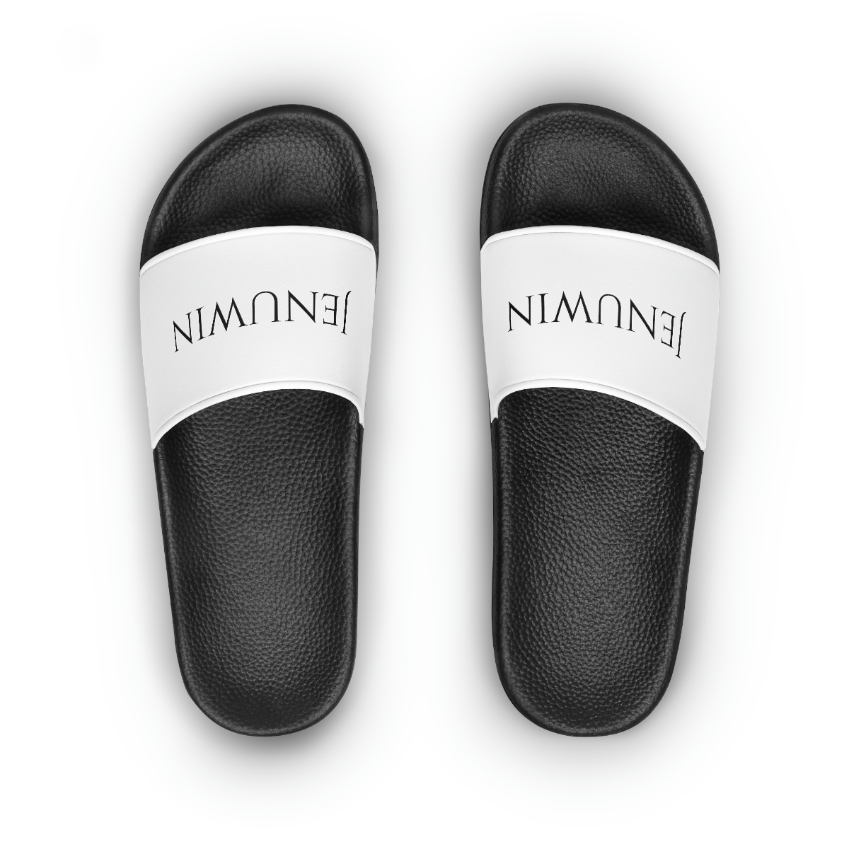 A pair of white and black sandals with the word " balmain ".