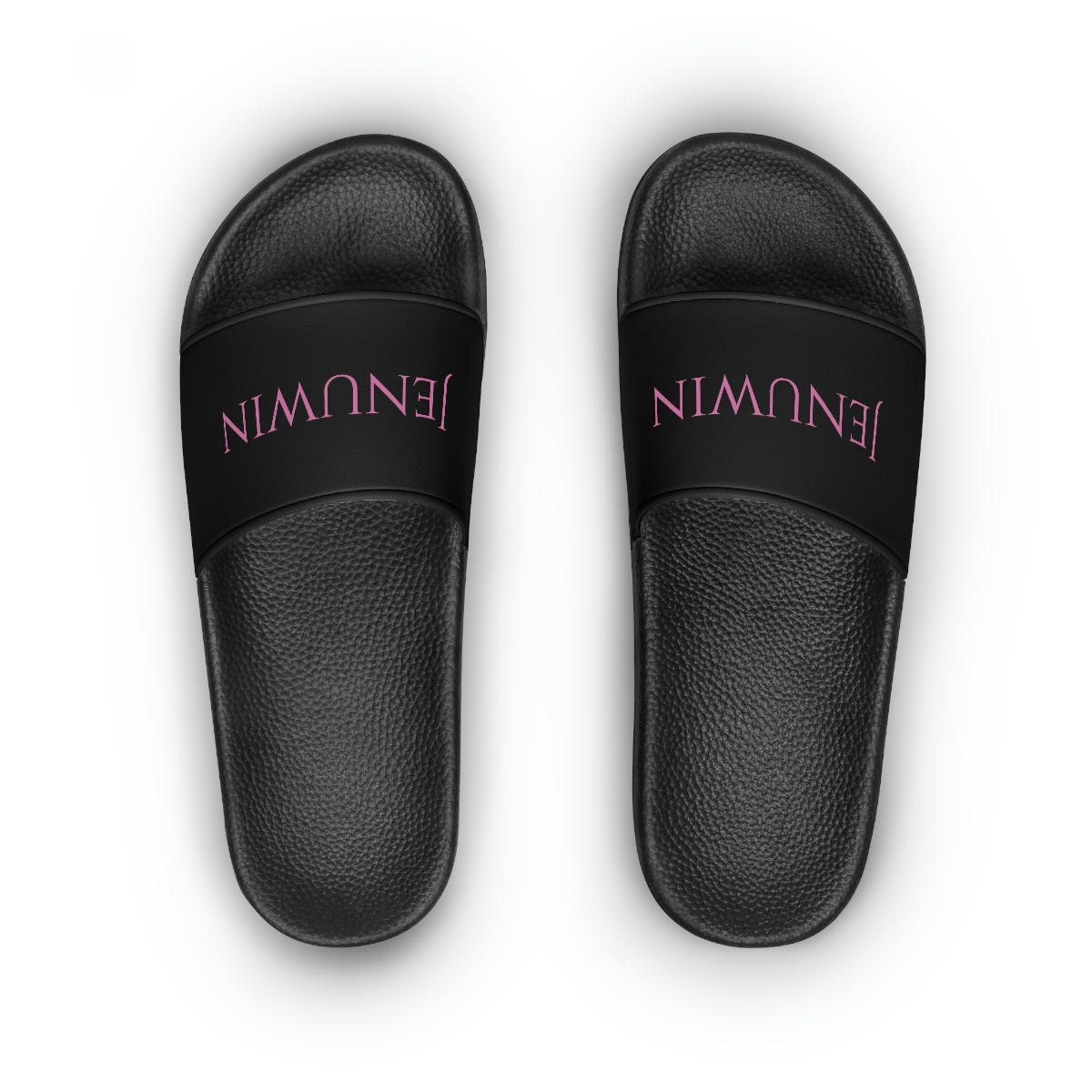 A pair of black sandals with the word " balmain " written on them.