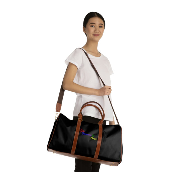 A woman holding onto a black bag