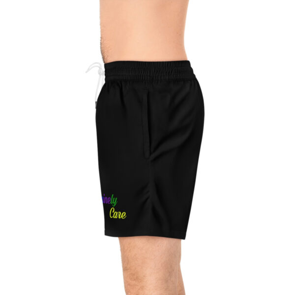 A man wearing black shorts with the words " stay clear " on it.