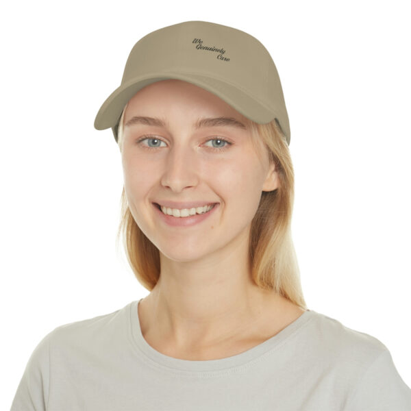 A woman wearing a hat with the word " sorry " written on it.