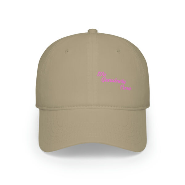 A tan hat with pink lettering on it.