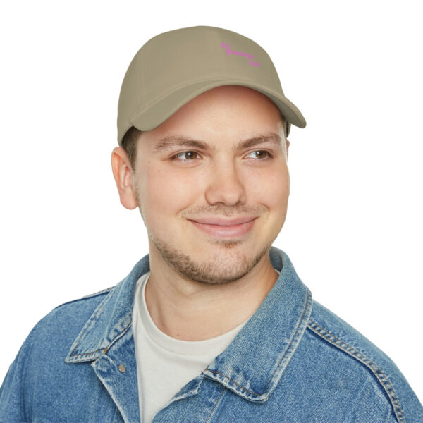 A man wearing a hat with the word " love " on it.