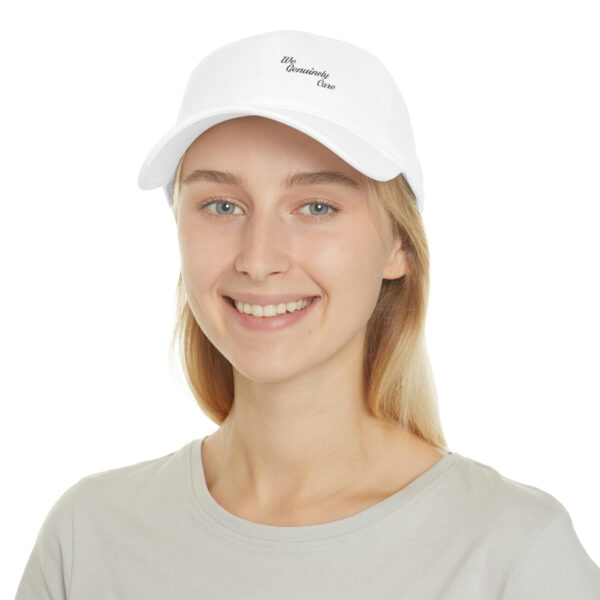 A woman wearing a white hat with the word " running " written on it.