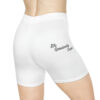 A close up of the back of a person wearing white shorts