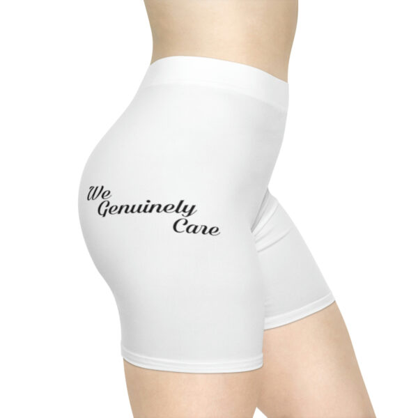 A woman wearing white shorts with the words " my genuinely care " on it.