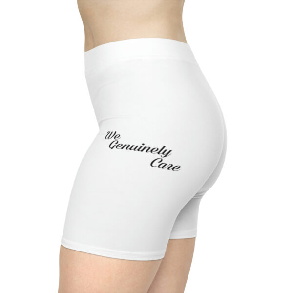 A woman wearing white shorts with the words " community citizen ".